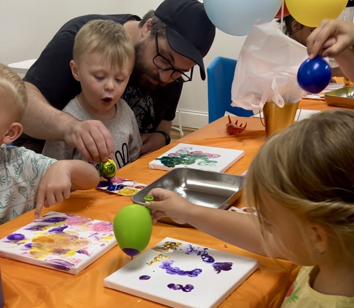 A child painting at an Altered Course art class
