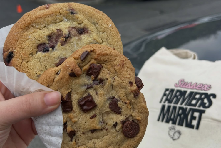 Fresh baked cookie and Sussex Farmers Market tote bag