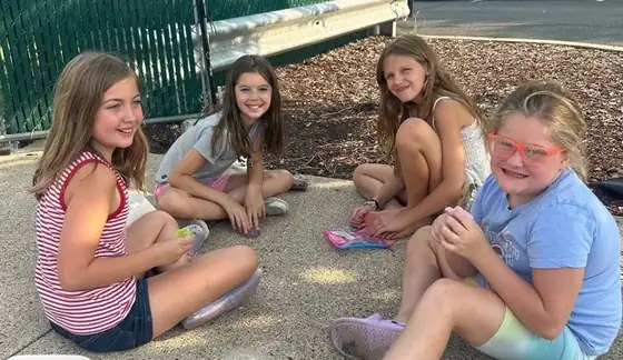 Four girls smiling together at Altered Course Venue in Sussex, NJ
